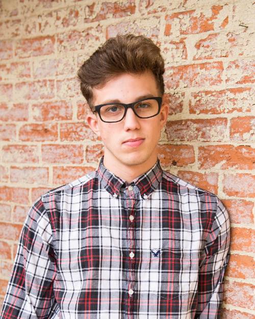 Picture of a young man in a plaid shirt. Photo by Jeffrey Reed from Pexels.