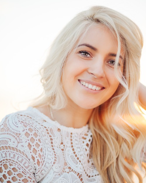 Picture of a blond female wearing white lace. Photo by Alexander Mils from Pexels